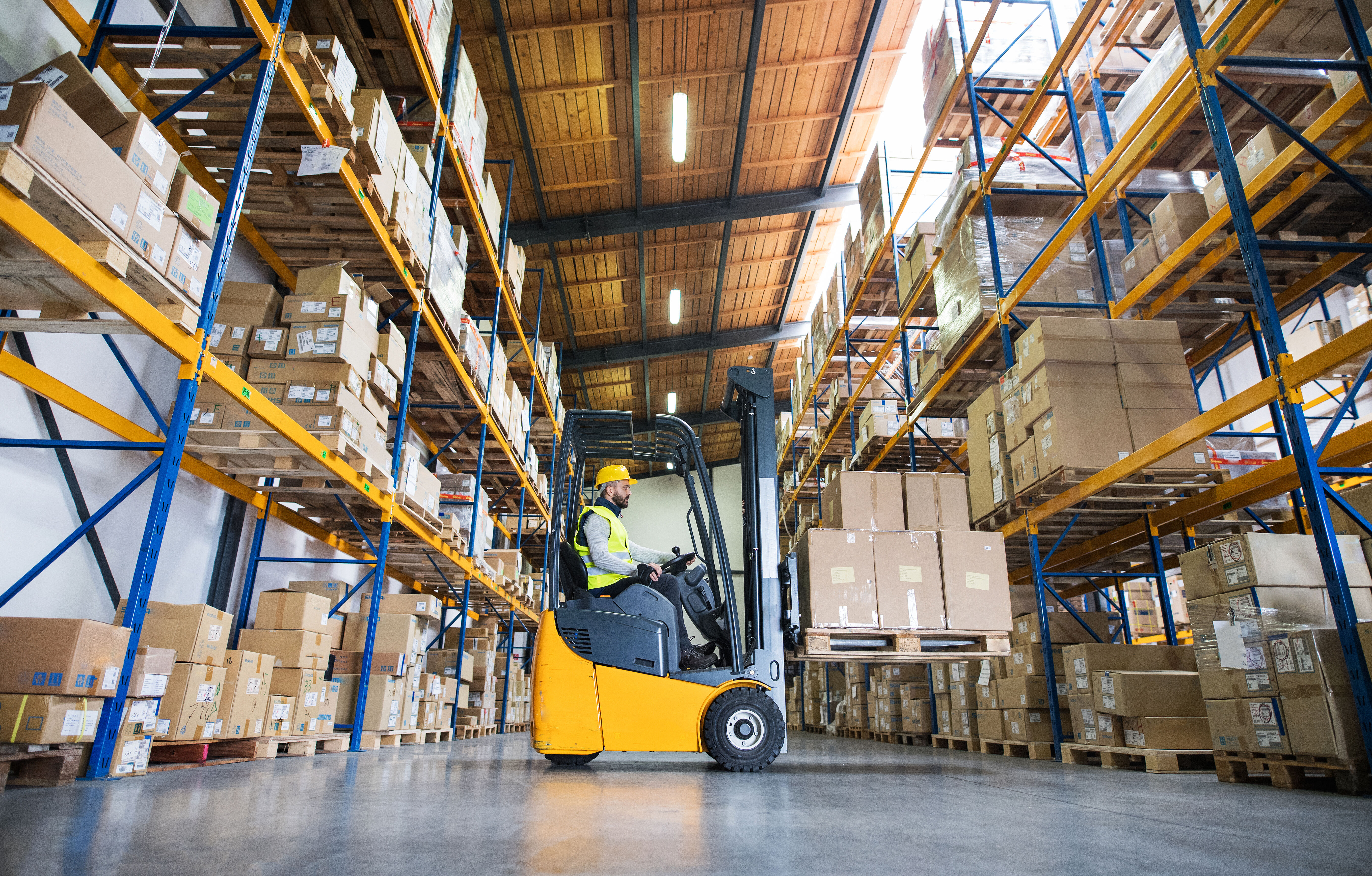 Warehouse man worker with forklift.
